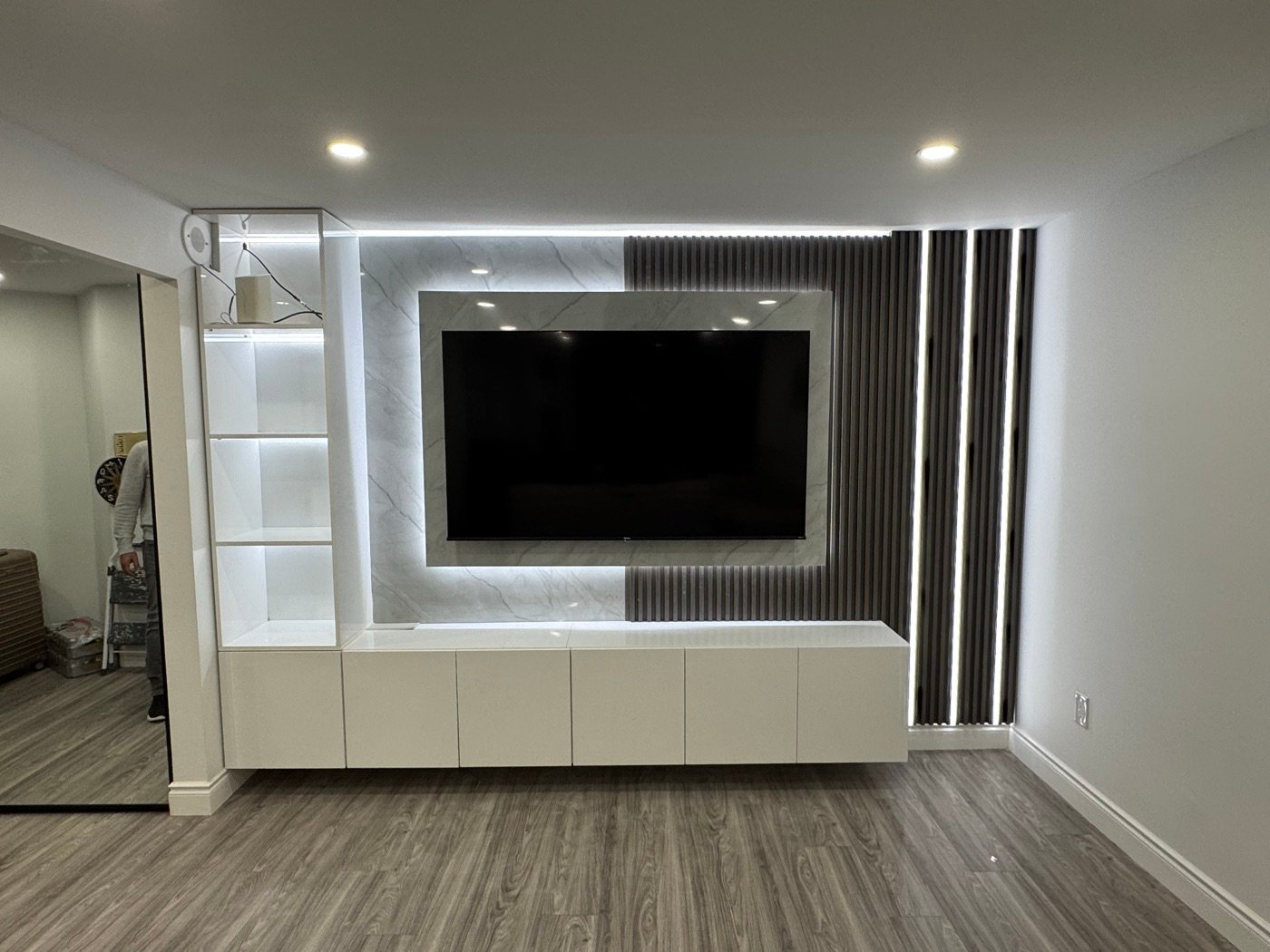 Finished custom media wall with fluted panels and LED